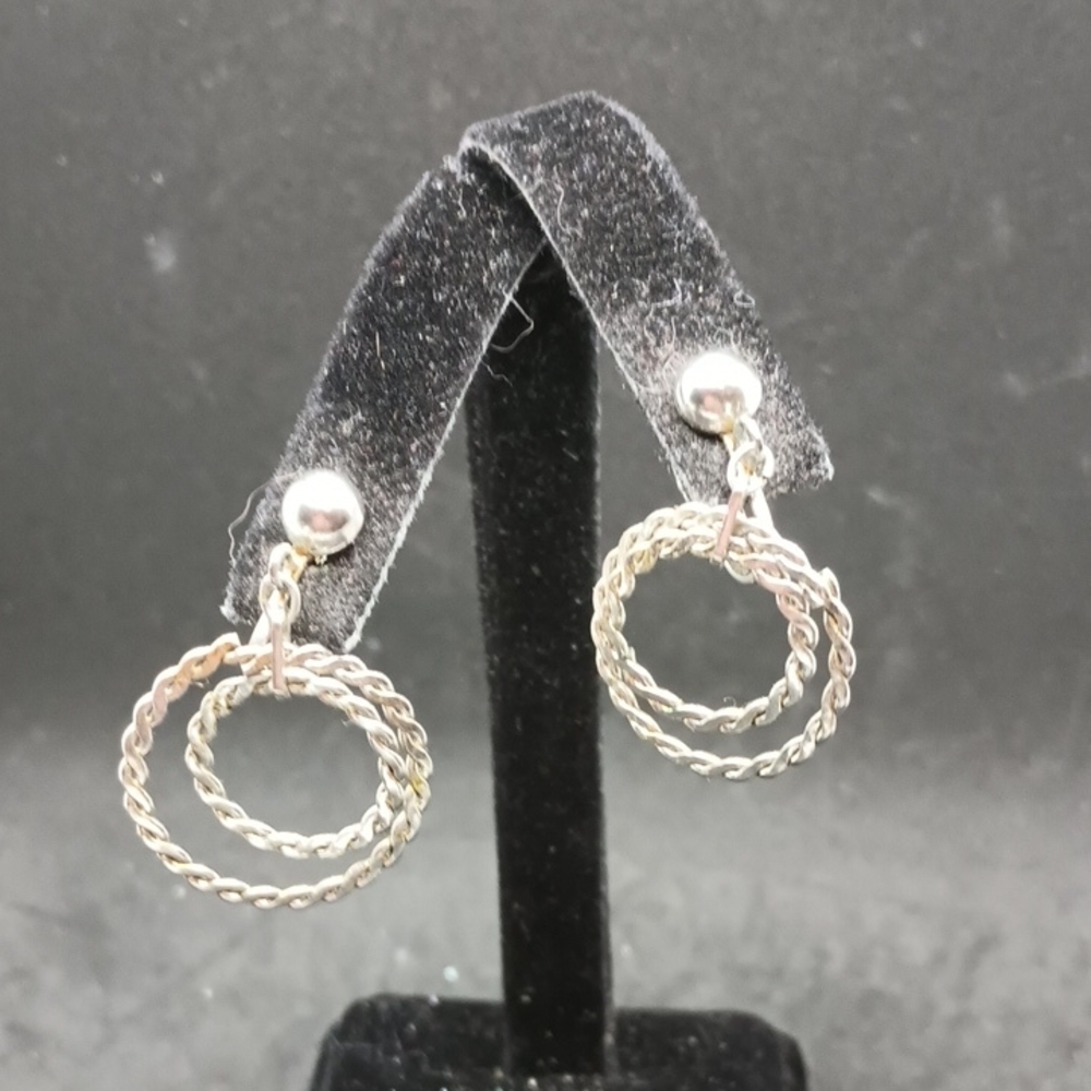 Silver Twisted Drop Clip Earrings with Braided Design